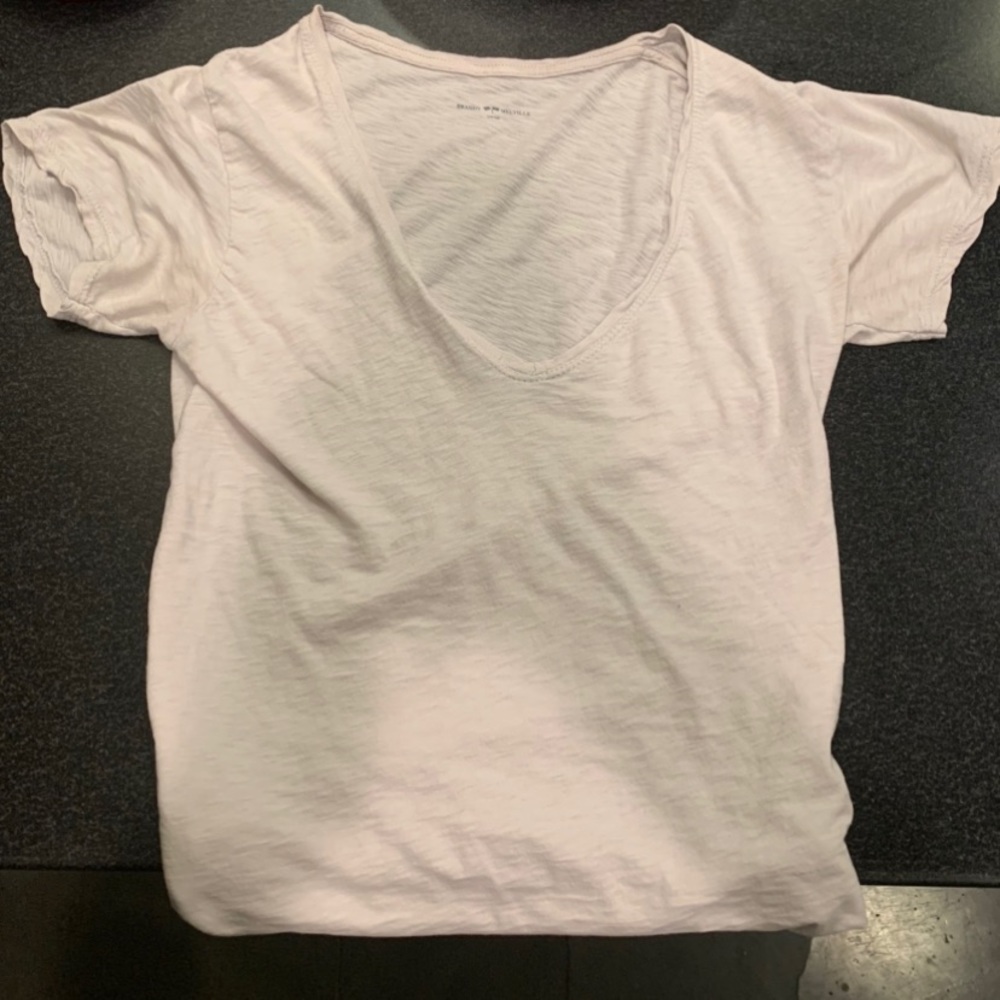 A cream colored v neck from brandy Melville